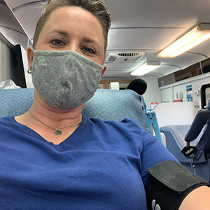 Jamie Vaughan sitting inside the Carter BloodCare bus